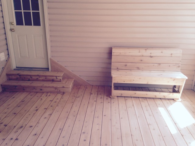 Pressure-treated deck with custom built-in bench and steps